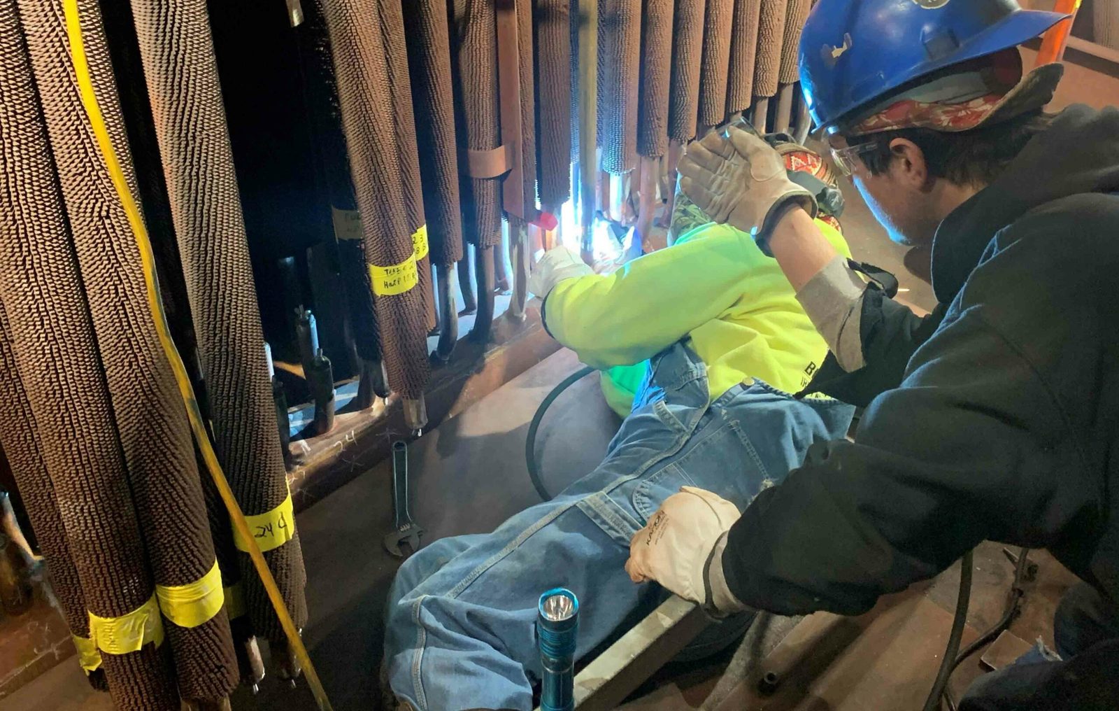 Boilermakers working safely at a power facility